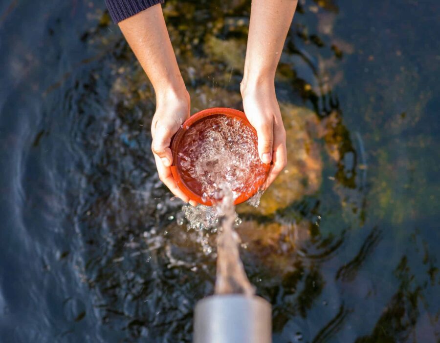 Photo showing clean water running into a vessel