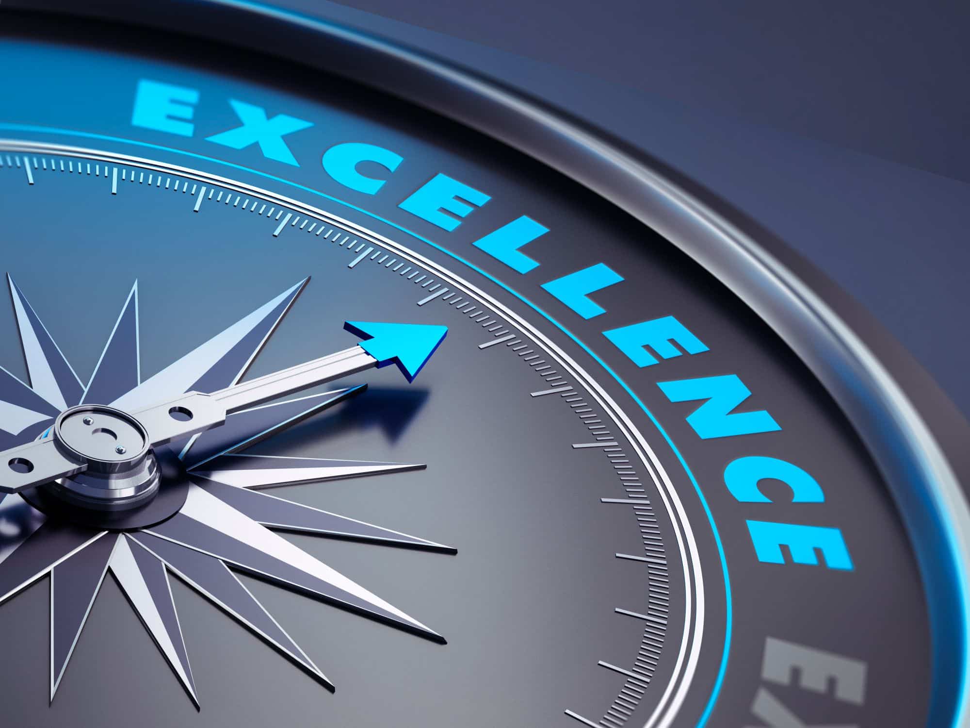 Compass with excellence written on it